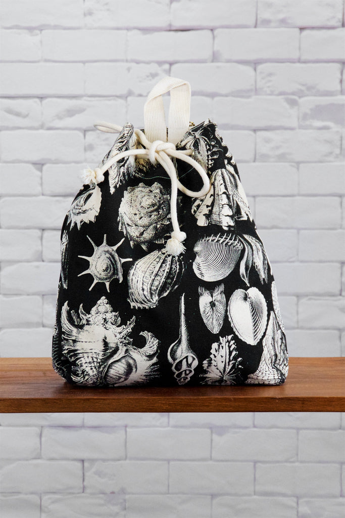 Backpack | Conch - backpack, black and white, book bag, canvas, caracol shell, day bag, day pack, drawing, hand printed, nature, regular backpack, sea, seashells, Shell, shell pattern, shells - Wander Emporium